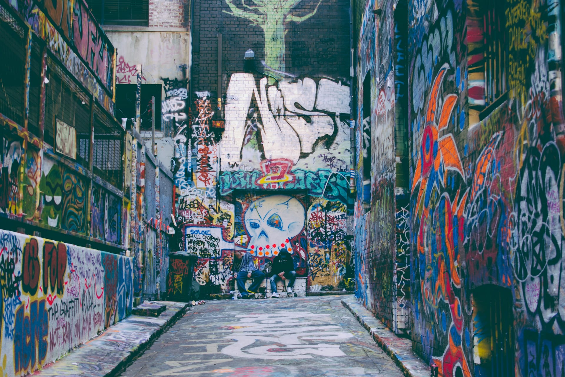 A laneway covered in colourful street art